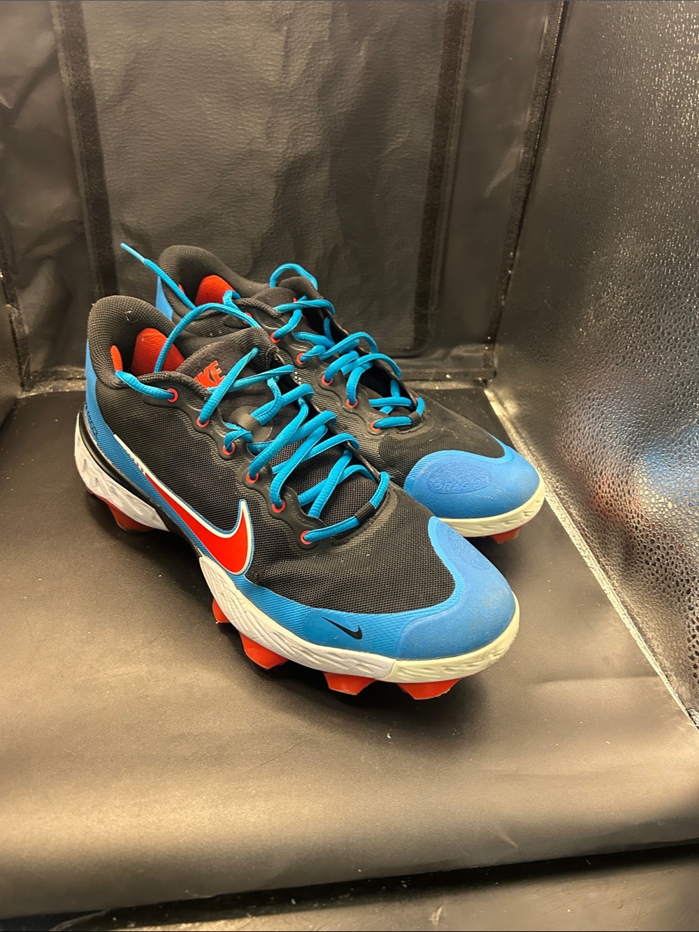Nike Men’s Black and Bright Blue Athletic Cleats with Orange Accents